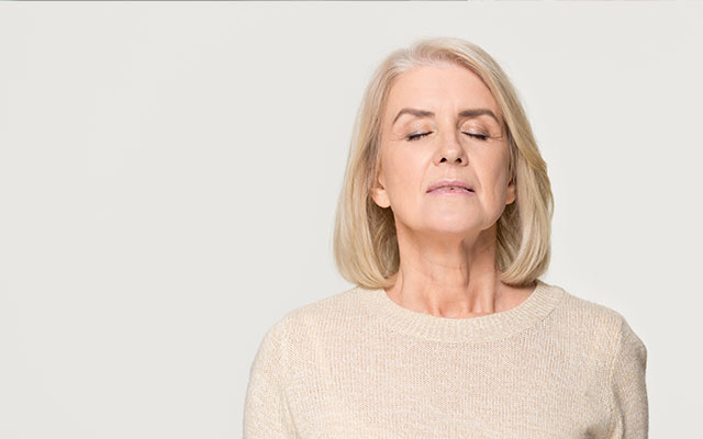 A middle aged woman focussing on her wellbeing