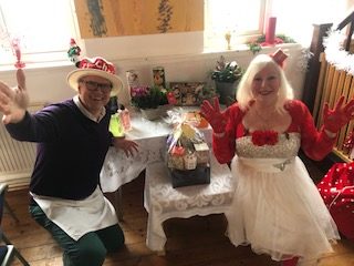 A couple having an afternoon tea with The Glamour Club