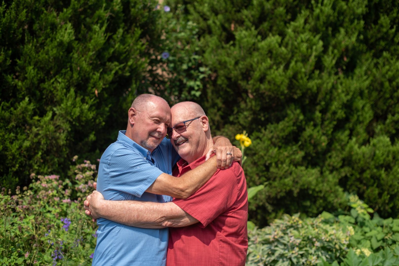Two men hugging | Embracing Inclusive care