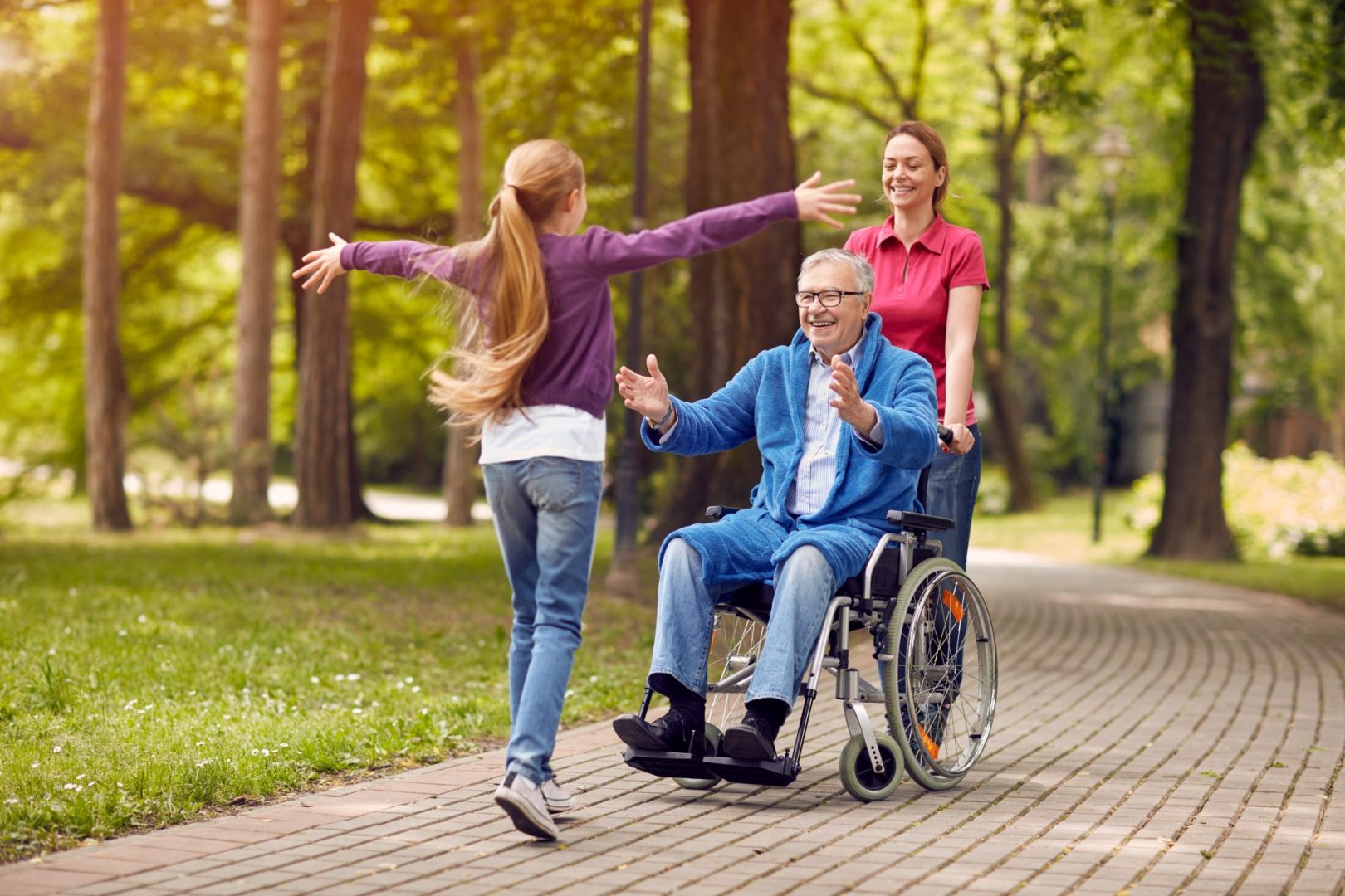 Carer helping a disabled man in a wheelchair