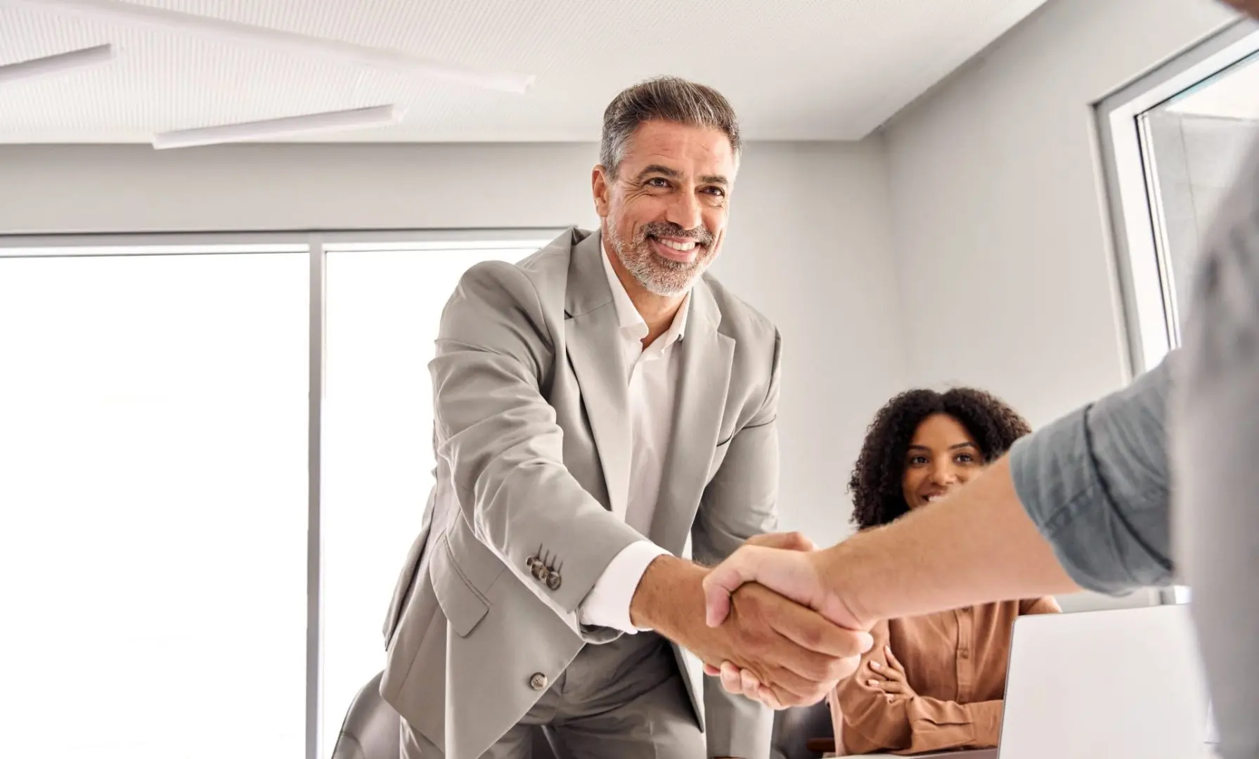 Hands shaking on a live-in care agreement